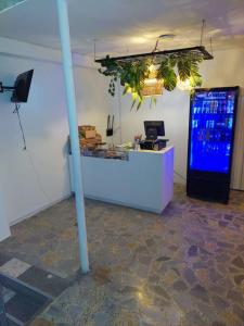 a room with a counter and a large vending machine at Hotel Bayadera Real in Medellín