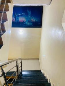 a staircase in a building with a view of a window at sonai POWERED BY PEACEFUL STUDIO in Panvel
