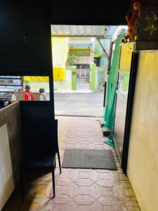 a view of a doorway of a restaurant with a chair at sonai POWERED BY PEACEFUL STUDIO in Panvel