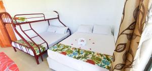 Postel nebo postele na pokoji v ubytování Island Accommodation Nadi