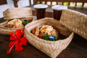 two baskets with food in them on a table at Ita House in Tegalalang