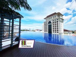 a hotel swimming pool on the roof of a building at BR Troika Homestay in Kota Bharu