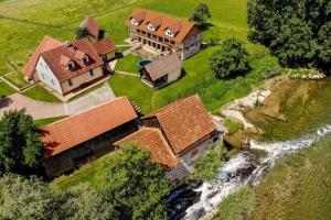an aerial view of a house and a river at Riverside Suite Mobile Homes in Gradac +22 photos