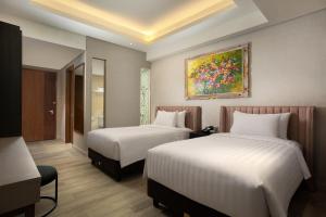 Ένα ή περισσότερα κρεβάτια σε δωμάτιο στο Trembesi Hotel +37 φωτογραφίες