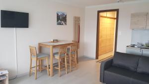 Televízia a/alebo spoločenská miestnosť v ubytovaní Apartment Wolfgangsee