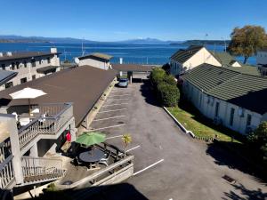 an aerial view of a parking lot next to the water at Absolute Lake View Motel in Taupo