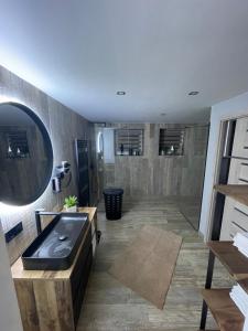 a bathroom with a sink and a bath tub at Apartmány Klicperka in Liberec