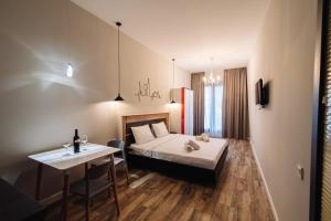 Postel nebo postele na pokoji v ubytování Wine Rock Hotel