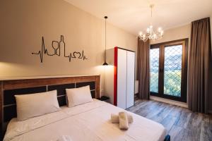 Postel nebo postele na pokoji v ubytování Wine Rock Hotel