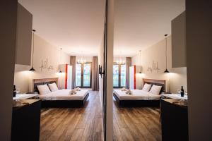 Postel nebo postele na pokoji v ubytování Wine Rock Hotel