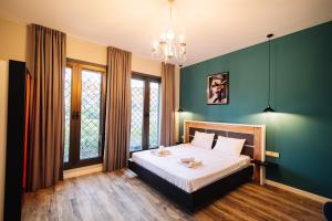 Postel nebo postele na pokoji v ubytování Wine Rock Hotel