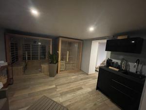 a living room with a television and a wooden floor at Apartmány Klicperka in Liberec