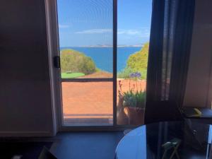 a view of the ocean from a room with a window at H&H studio overlooking Boston Bay, Port Lincoln in Port Lincoln