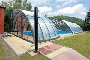 a dome house next to a swimming pool at Penzion Samoty in Železná Ruda