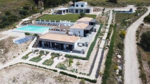 an aerial view of a house with a swimming pool at KEFI SPITIA in Simotáta