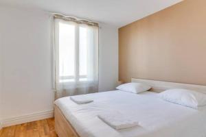 Posteľ alebo postele v izbe v ubytovaní L'Indigo - Les Maisons de Madeleine