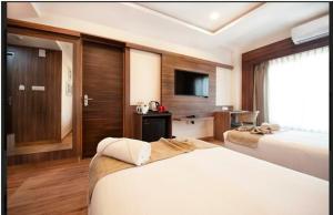 Purple Cloud Hotel客房内的一张或多张床位
