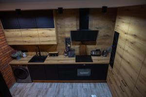 Kuchyň nebo kuchyňský kout v ubytování HORTUS apartament z klimatyzacją