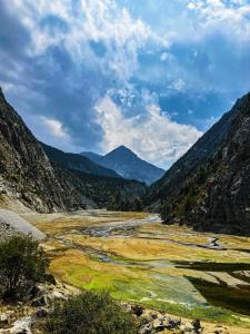 a view of a valley with mountains in the background at Stunning Lakeside Villa in Korumdy +11 photos