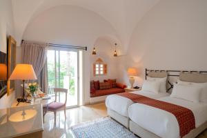 Кровать или кровати в номере The Residence Tunis