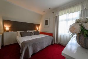 Posteľ alebo postele v izbe v ubytovaní Hotel Zelená Marina