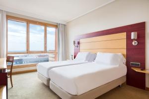 A bed or beds in a room at Abba Garden