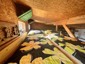 a bedroom with a bed with flowers on it at DVOR POD KRíKMI in Spišský Štvrtok
