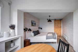 Postel nebo postele na pokoji v ubytování d.Five Vineyard & Retreat Kőröshegy