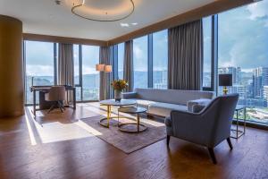 a living room with a couch and a table at Radisson Collection Hotel, Vadistanbul in Istanbul