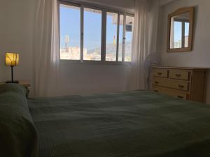 Łóżko lub łóżka w pokoju w obiekcie Apartamento Fuengirola beach
