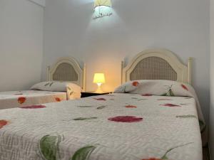 Łóżko lub łóżka w pokoju w obiekcie Apartamento Fuengirola beach