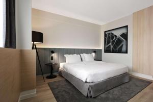 Säng eller sängar i ett rum på Radisson Blu Hotel, Hasselt