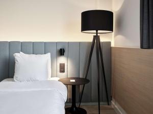 Rúm í herbergi á Radisson Blu Hotel, Hasselt