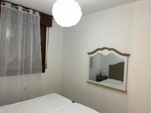 Ein Bett oder Betten in einem Zimmer der Unterkunft Bilocale country chic 'Maison Rose' two km from the Modena Sud exit