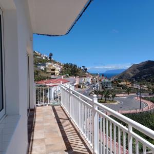 a balcony with a view of a street at Casa Efraim in Hermigua