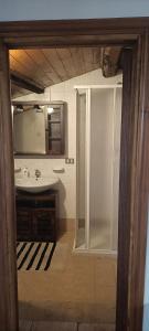 a bathroom with a shower and a sink at Il cielo in una stanza in Foligno