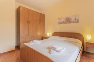Posteľ alebo postele v izbe v ubytovaní San Carlo - private beach