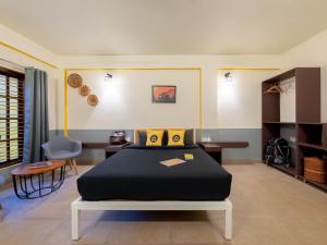 Letto o letti in una camera di The Hosteller Coorg Rainforest, Madikeri