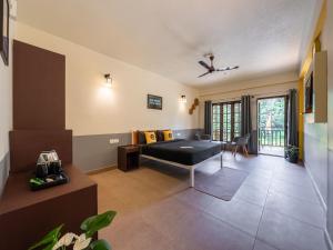 Letto o letti in una camera di The Hosteller Coorg Rainforest, Madikeri