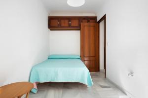 Postel nebo postele na pokoji v ubytování Apartamento Romo