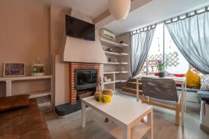 TV a/nebo společenská místnost v ubytování Precioso apartamento en Granada