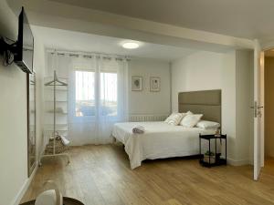 מיטה או מיטות בחדר ב-Vianeando