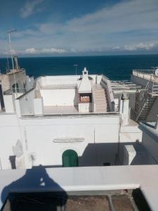 a view of the ocean from the roof of a building at La Dimora di Nonna Lucia in Polignano a Mare