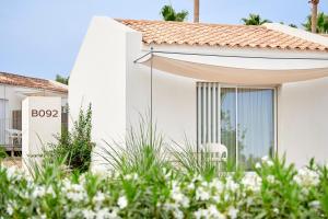 A garden outside Iberostar Waves Cala Domingos All Inclusive