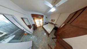 an overhead view of a room with a sink and a staircase at El Hotelito in San José