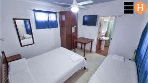 El Hotelito tesisinde bir odada yatak veya yataklar