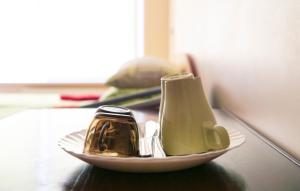 a plate with utensils on top of a table at Motelis Jonučiai in Garliava
