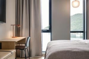 Postel nebo postele na pokoji v ubytování Quality Hotel Harstad