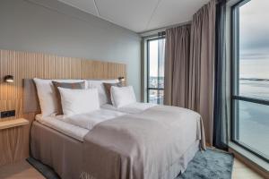 Postel nebo postele na pokoji v ubytování Quality Hotel Harstad