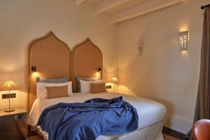 Postel nebo postele na pokoji v ubytování Puro Grand Hotel